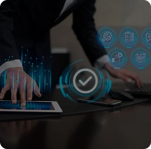 Professional working on laptop with virtual dashboard icons, representing IT infrastructure monitoring and management.